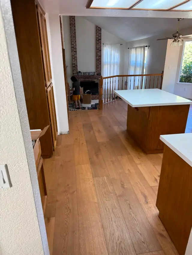 Wide-plank LVP flooring installed in an open kitchen and living area in Rancho Cordova