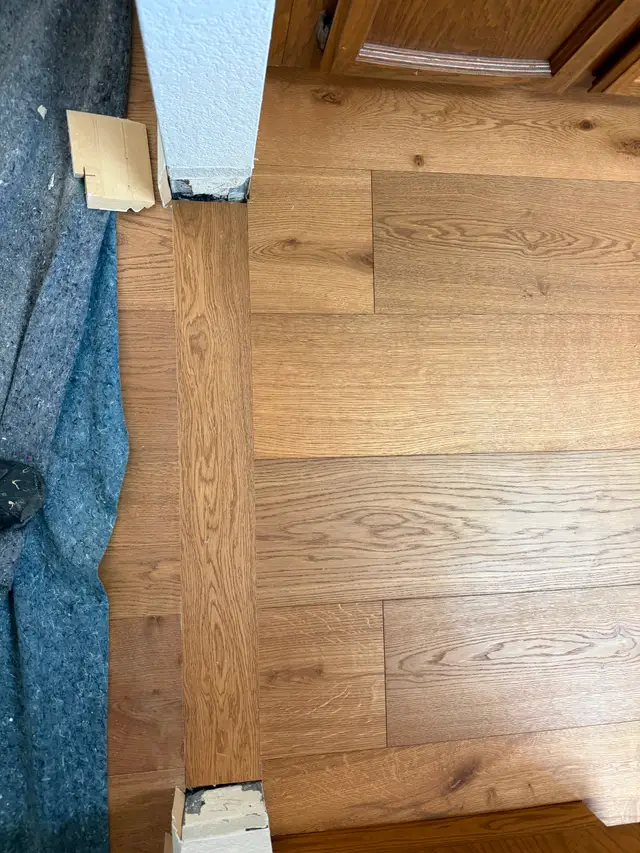 Doorway transition detail during vinyl plank flooring installation