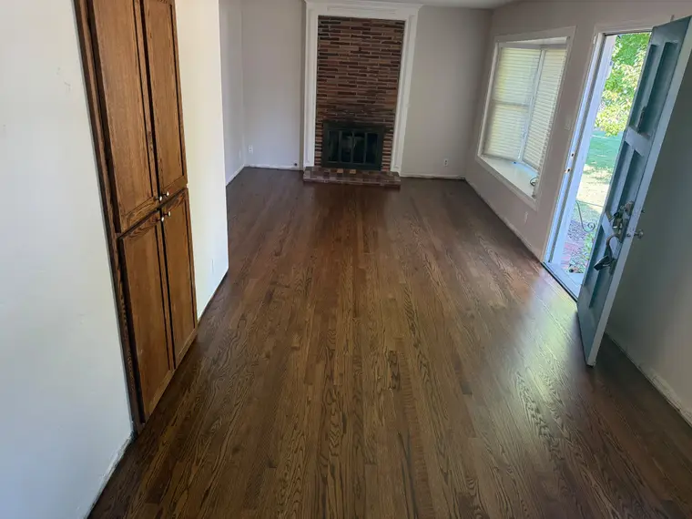 After: Worn dark oak sanded down and refinished in a warm walnut stain