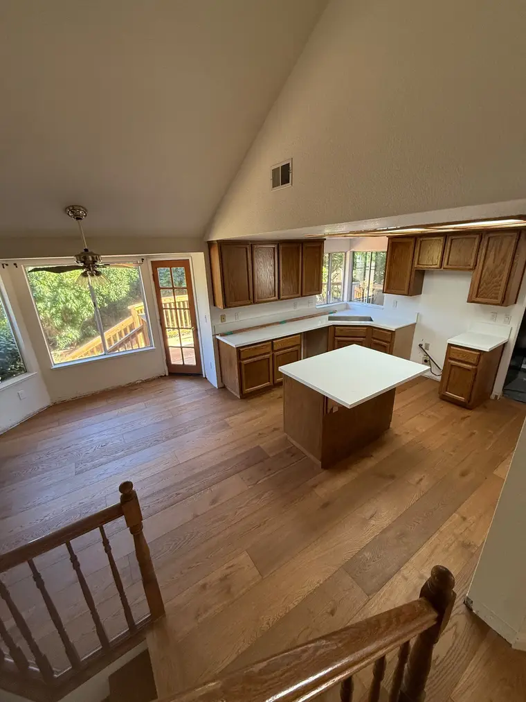 After: Tile demo to a bright open kitchen with new wide plank floors