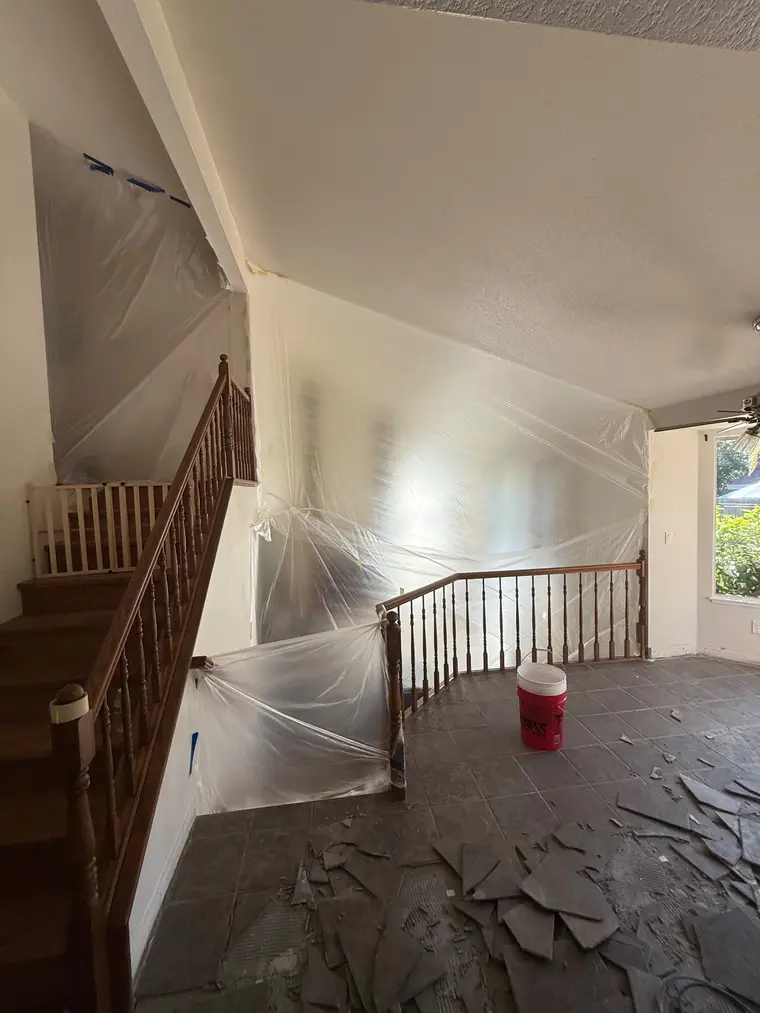 Before: Tile demo to a bright open kitchen with new wide plank floors